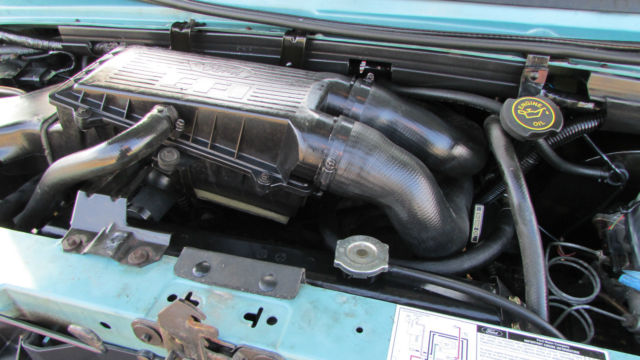 1994 Teal Ford E-Series Van 15 Passenger Van
