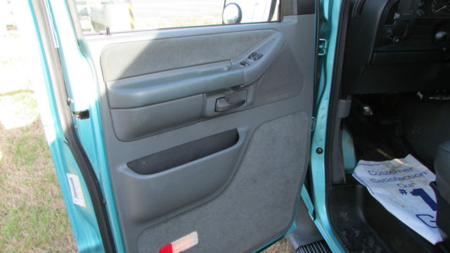 1994 Teal Ford E-Series Van 15 Passenger Van