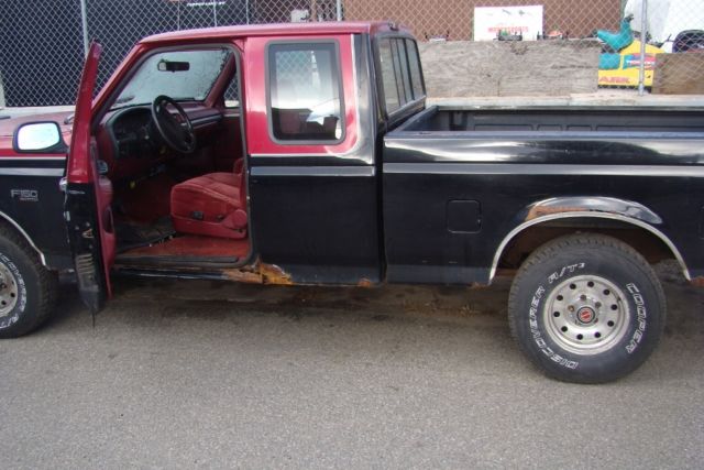 1994 Black and Red Ford F-150 Extended Cab Pickup