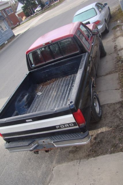 1994 Black and Red Ford F-150 Extended Cab Pickup