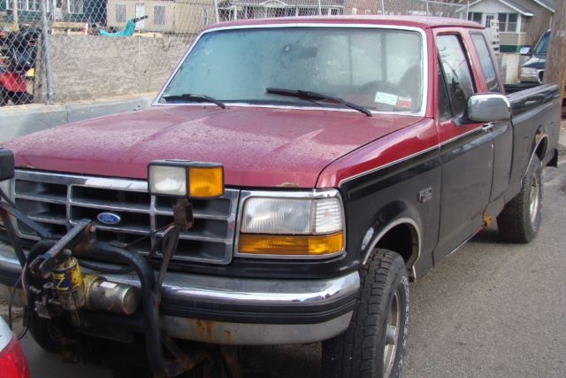 1994 Black and Red Ford F-150 Extended Cab Pickup