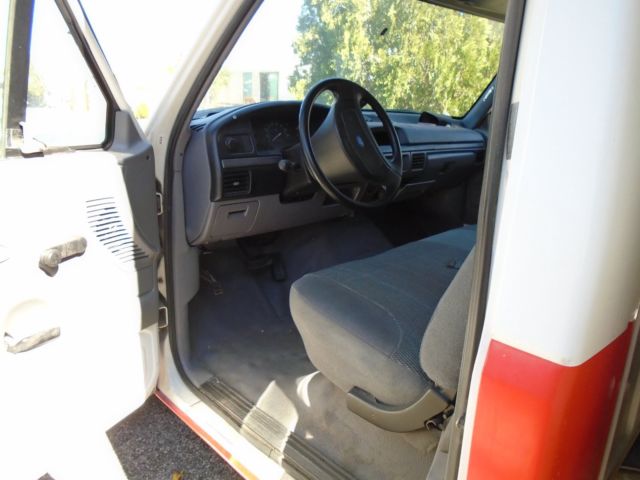 1994 white/orange Ford F-350 van