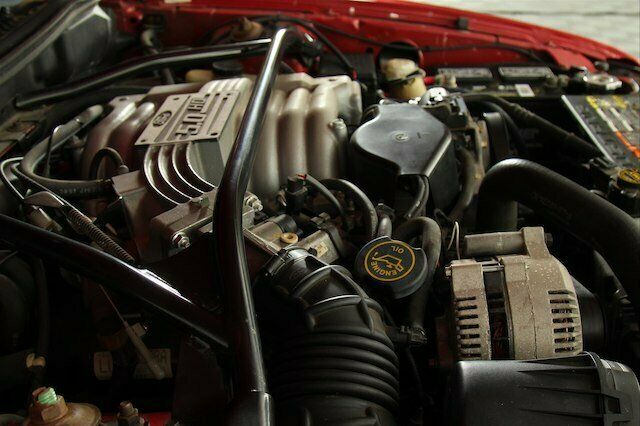 1994 Red Ford Mustang --