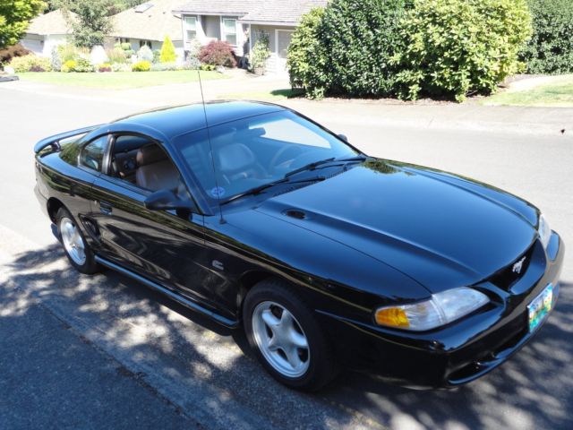 1994 black Ford Mustang sports coupe