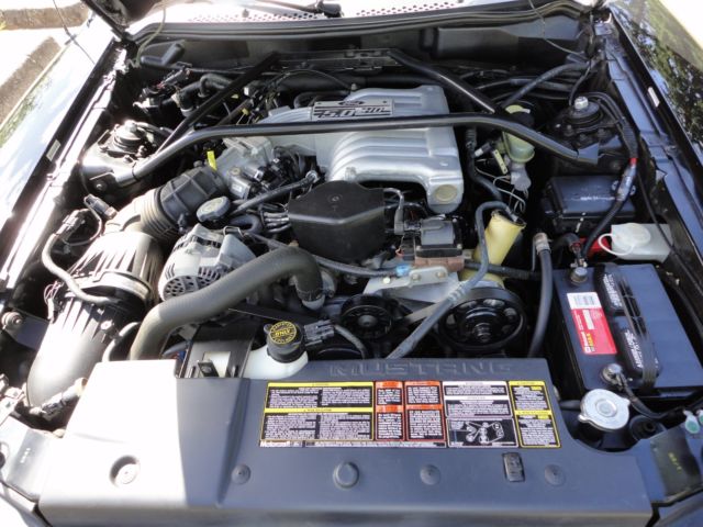 1994 black Ford Mustang sports coupe