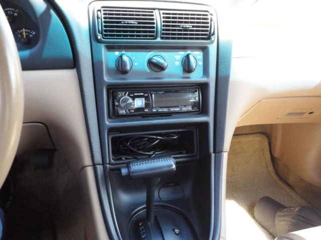1994 black Ford Mustang sports coupe