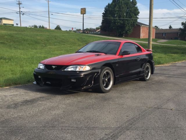 1994 Red over Black with Charcoal pinstripe Ford Mustang