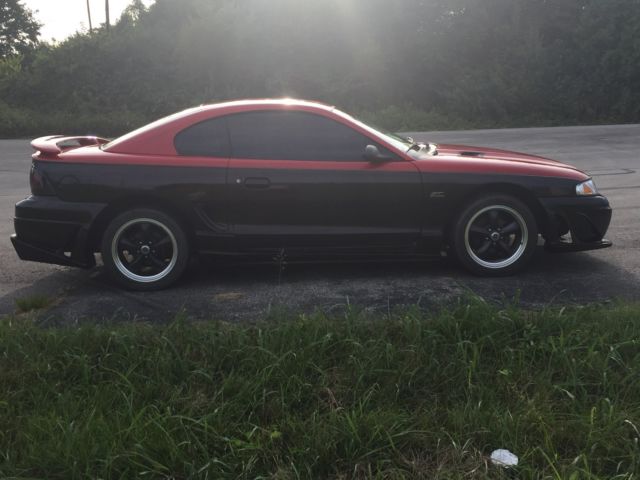 1994 Red over Black with Charcoal pinstripe Ford Mustang