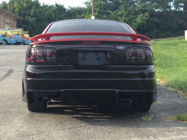 1994 Red over Black with Charcoal pinstripe Ford Mustang