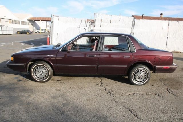 1994 Red Oldsmobile Cutlass Sedan