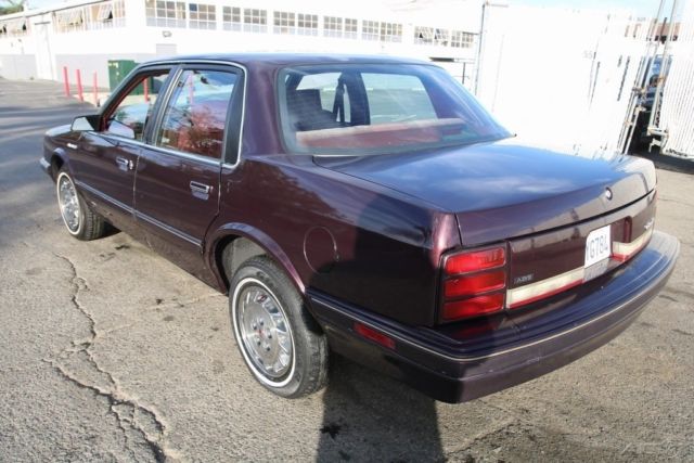 1994 Red Oldsmobile Cutlass Sedan