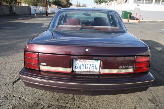 1994 Red Oldsmobile Cutlass Sedan