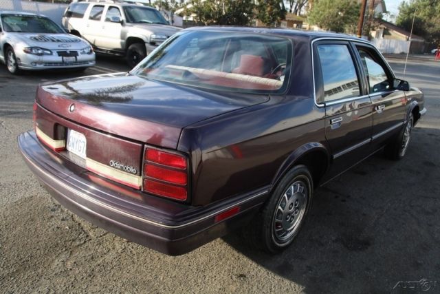 1994 Red Oldsmobile Cutlass Sedan