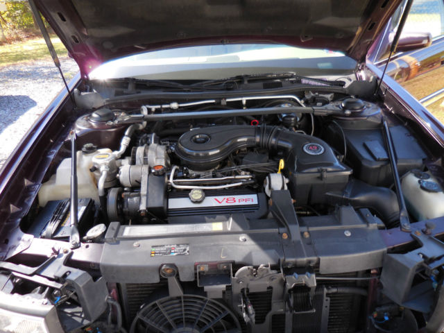1994 Burgundy Cadillac DeVille Sedan