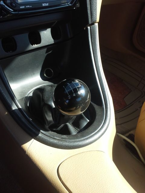 1994 orange Ford Mustang 2 door