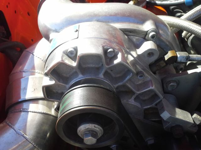 1994 orange Ford Mustang 2 door