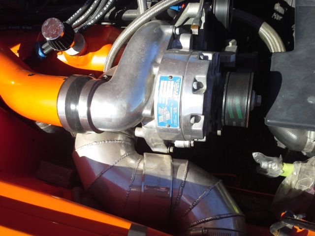 1994 orange Ford Mustang 2 door