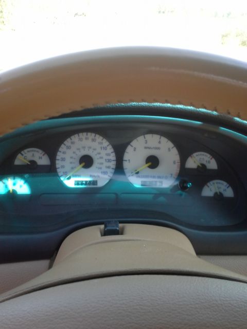 1994 orange Ford Mustang 2 door