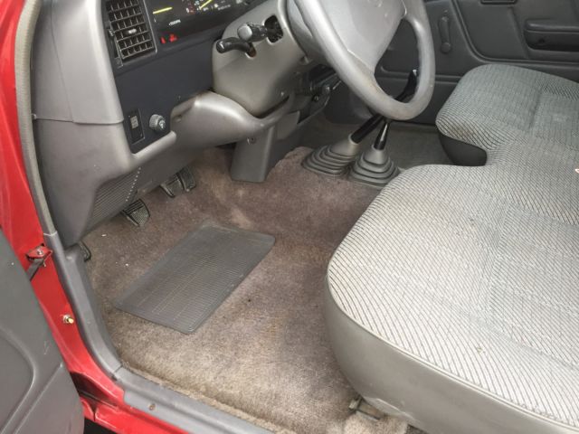 1994 Burgundy Toyota Tacoma pickup