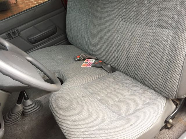 1994 Burgundy Toyota Tacoma pickup