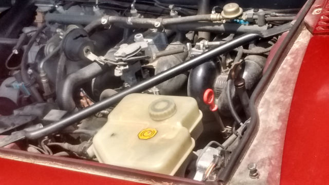 1994 metalic burgandy Jaguar XJS Coupe