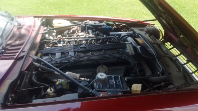 1994 metalic burgandy Jaguar XJS Coupe