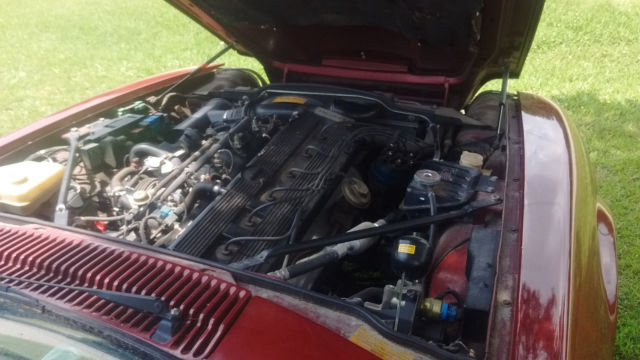 1994 metalic burgandy Jaguar XJS Coupe