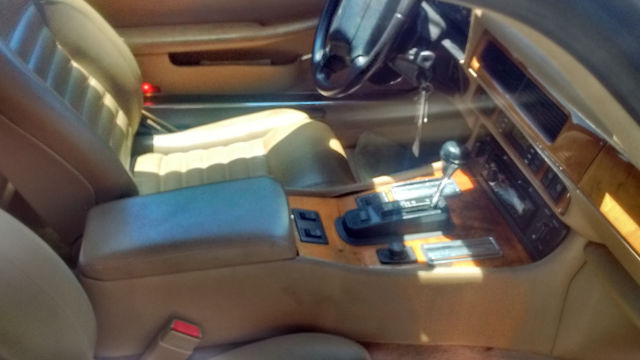 1994 metalic burgandy Jaguar XJS Coupe