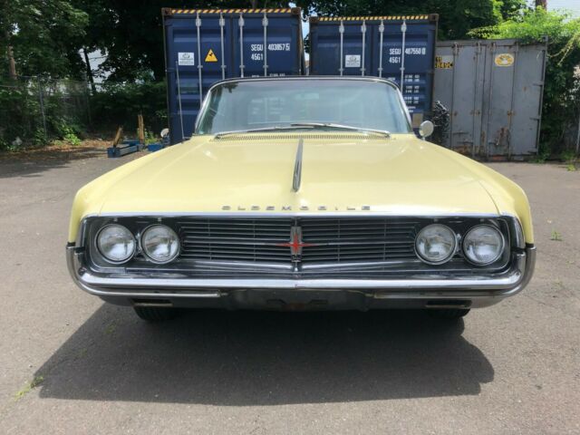 1962 Yellow Oldsmobile Starfire Coupe