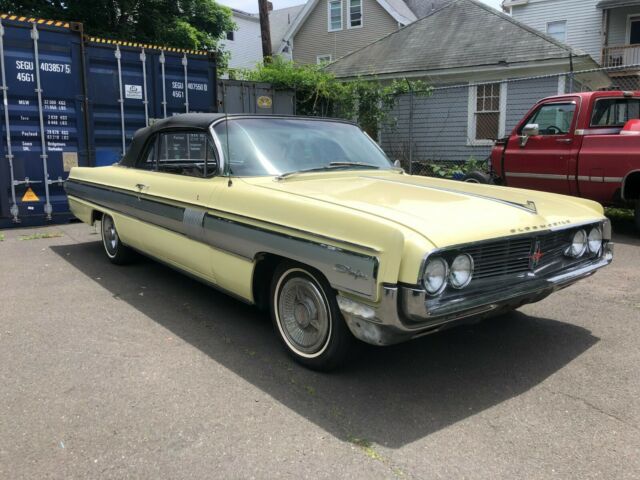 1962 Yellow Oldsmobile Starfire Coupe