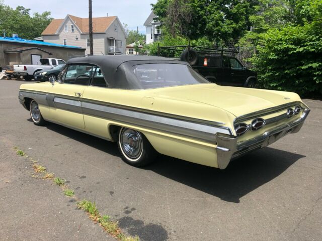1962 Yellow Oldsmobile Starfire Coupe