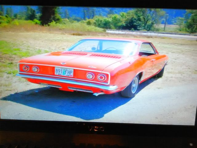 1965 Red Chevrolet Corvair Coupe