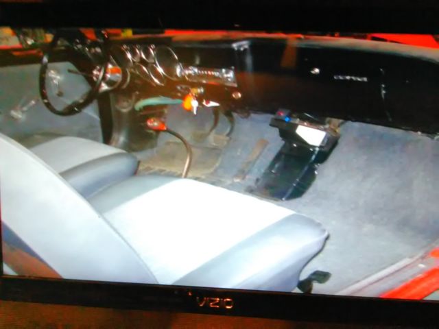 1965 Red Chevrolet Corvair Coupe