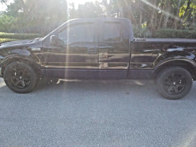 0005 black Ford F-150 Extended Cab Pickup