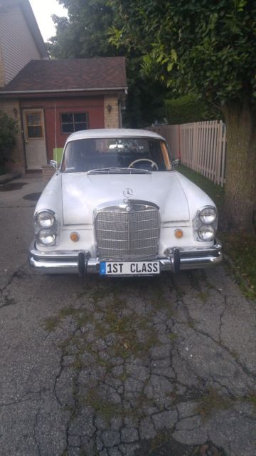 1965 White Mercedes-Benz 200-Series Sedan