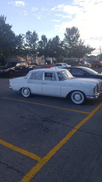 1965 White Mercedes-Benz 200-Series Sedan