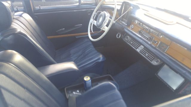 1965 White Mercedes-Benz 200-Series Sedan