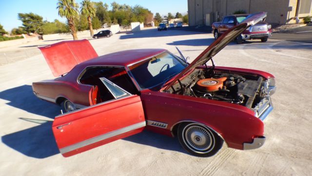 1966 Burgundy Oldsmobile Starfire Coupe