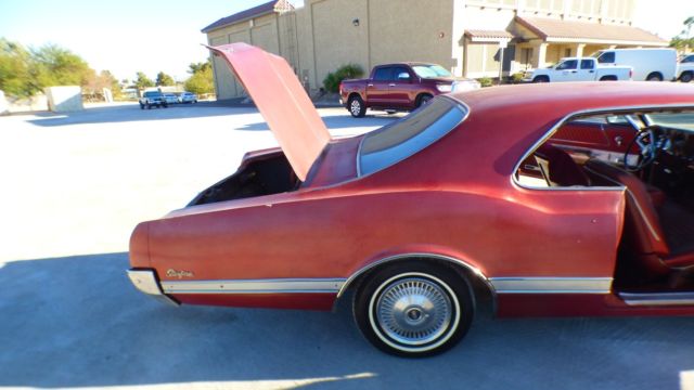 1966 Burgundy Oldsmobile Starfire Coupe