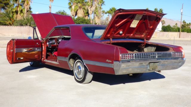 1966 Burgundy Oldsmobile Starfire Coupe