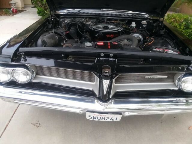 1962 Black (originally white but you can't tell) Pontiac Grand Prix Coupe