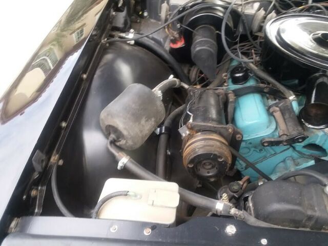 1962 Black (originally white but you can't tell) Pontiac Grand Prix Coupe