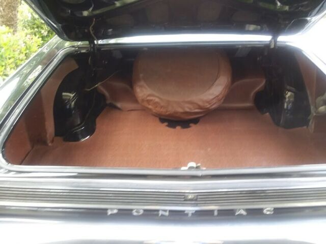 1962 Black (originally white but you can't tell) Pontiac Grand Prix Coupe