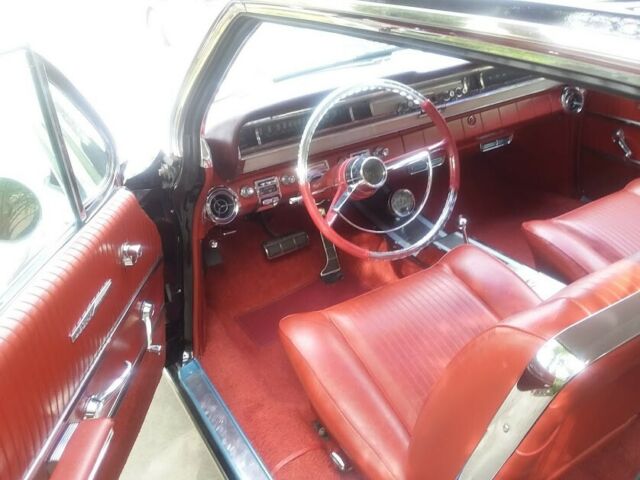 1962 Black (originally white but you can't tell) Pontiac Grand Prix Coupe