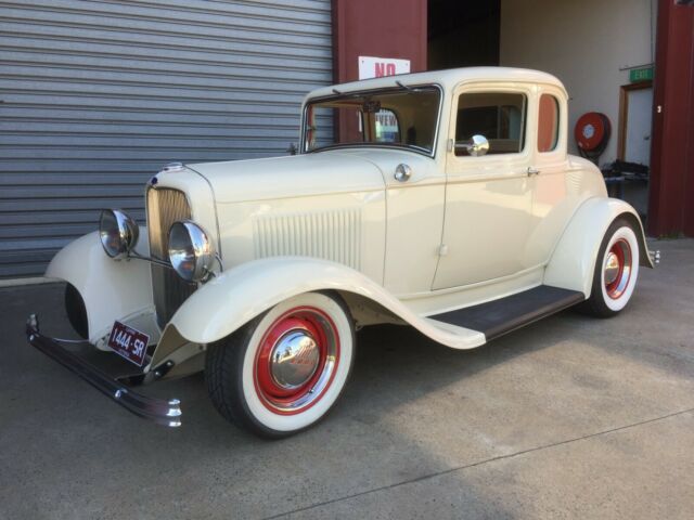 1932 cream Ford Model A Coupe