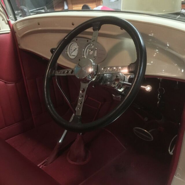 1932 cream Ford Model A Coupe