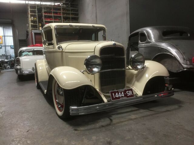 1932 cream Ford Model A Coupe