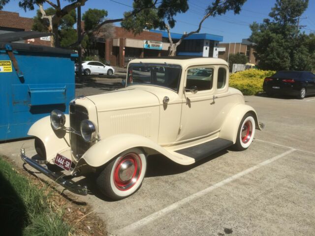 1932 cream Ford Model A Coupe
