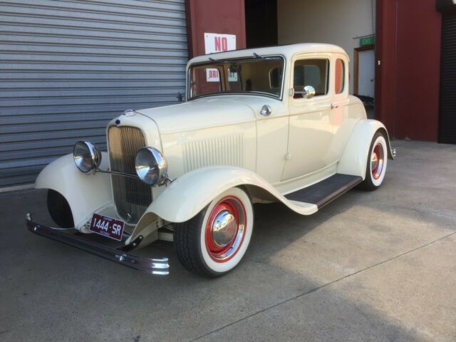 1932 cream Ford Model A Coupe