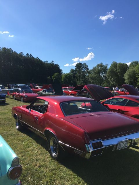 1972 Red metallic Oldsmobile Cutlass Coupe